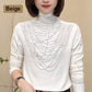 Damesblouse met hoge kraag, lange mouwen en voering